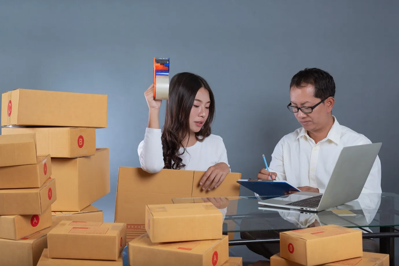 men-women-are-helping-pack-boxes